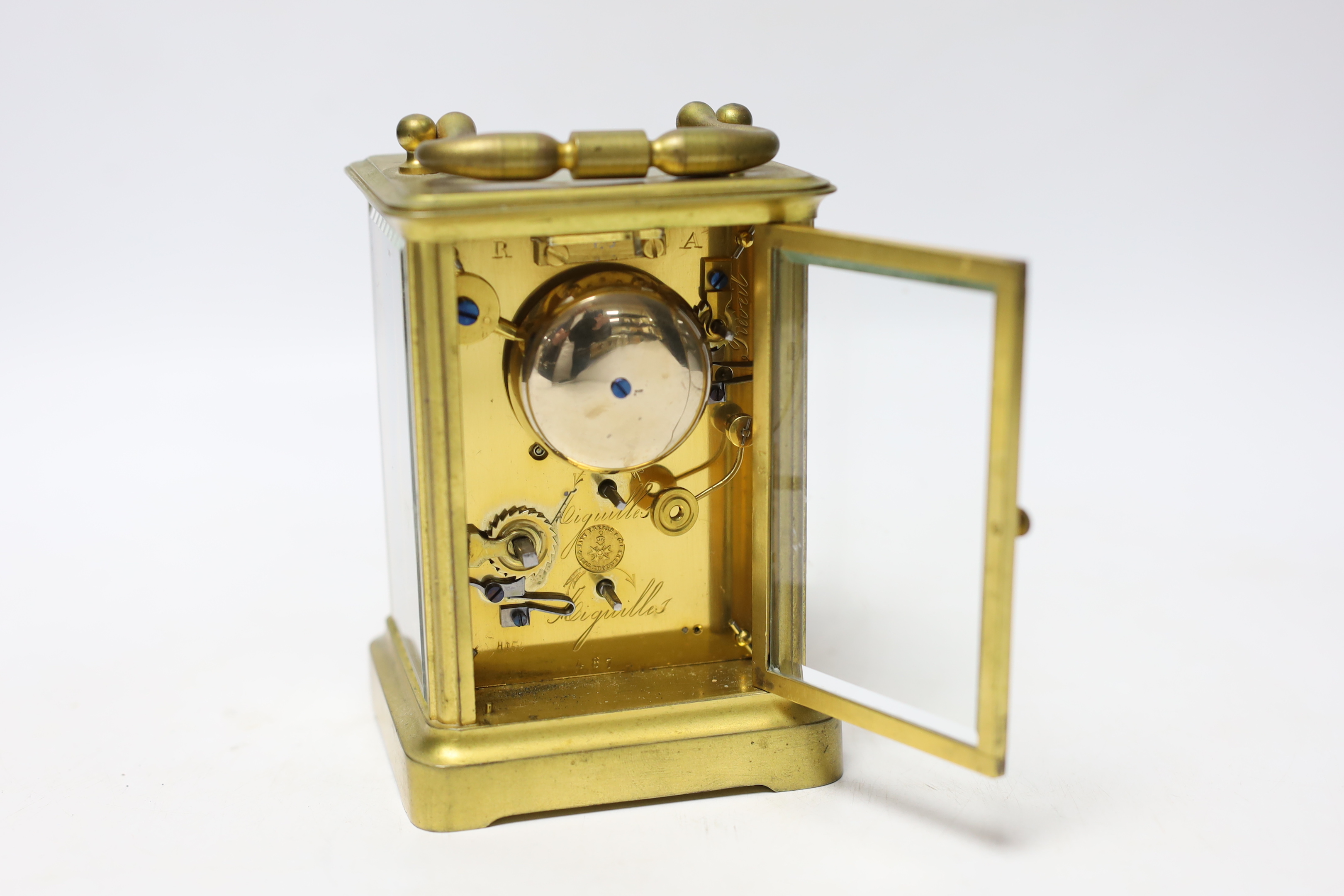 A French brass carriage clock striking on a bell, 12cm